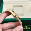 Super Clone Rolex Day-Date Champagne Diamond Dial 128238-0132 36 mm — on leather display