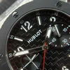 Super Clone Hublot Big Bang 20th Anniversary Titanium Ceramic 43mm 431.NM.1337.RX — on leather display